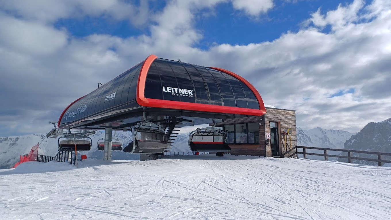 Ladurns in Italy - a ski lift on top of a snowy mountain.
