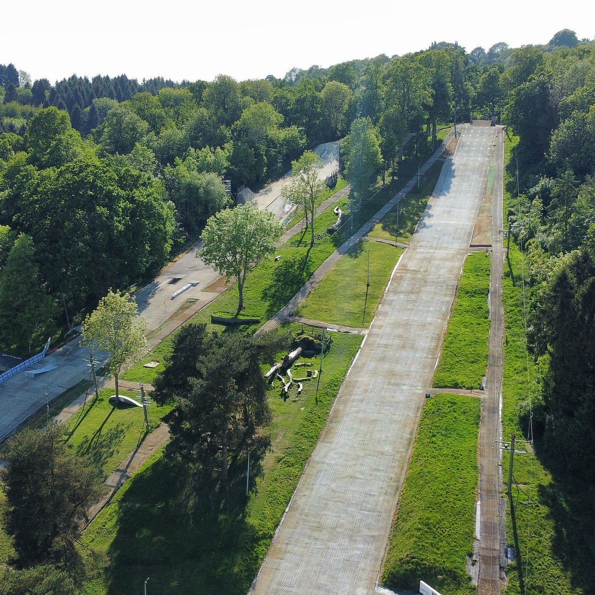 Gloucester Ski & Snowboard Centre in United Kingdom: an aerial view of a park with trees and buildings.