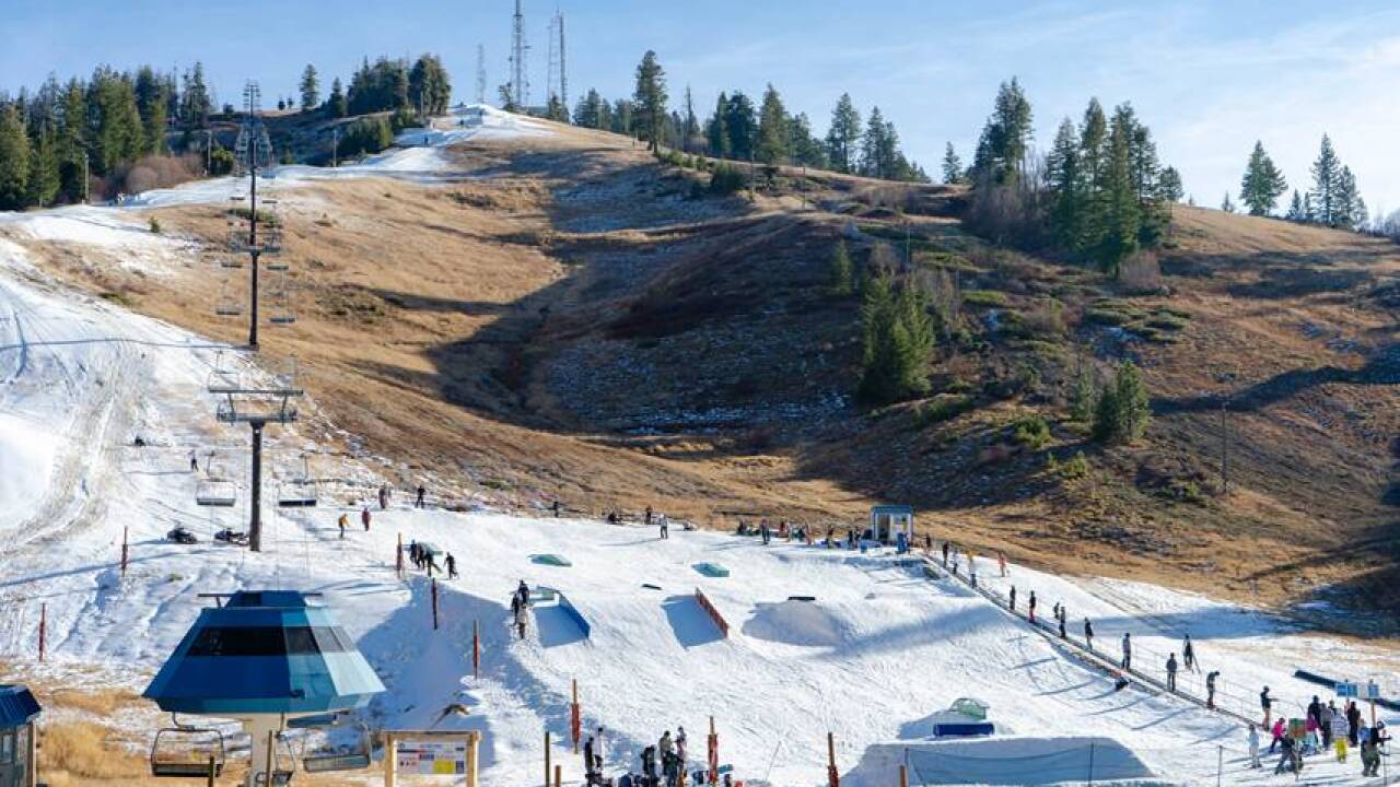 Bogus Basin in USA - a ski slope with people skiing down it.