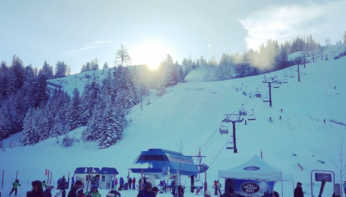 Bogus Basin in USA - a group of people standing on top of a ski slope.