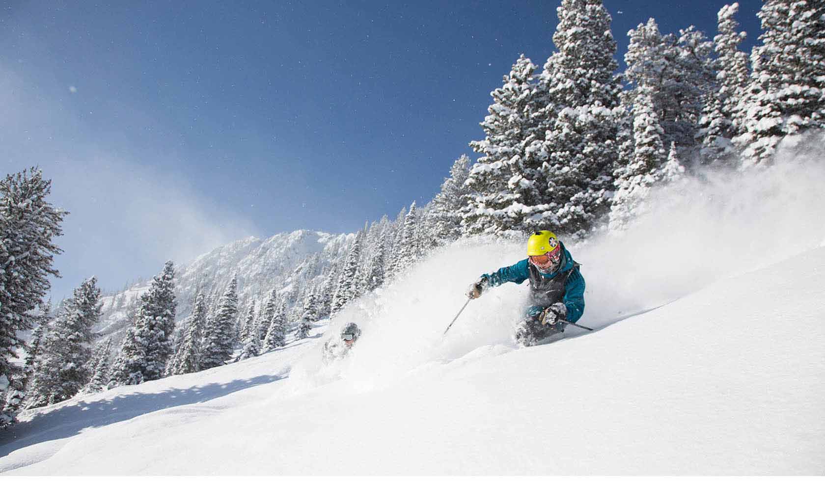 Bridger Bowl – Bozeman in USA - a person riding a snowboard down a slope.