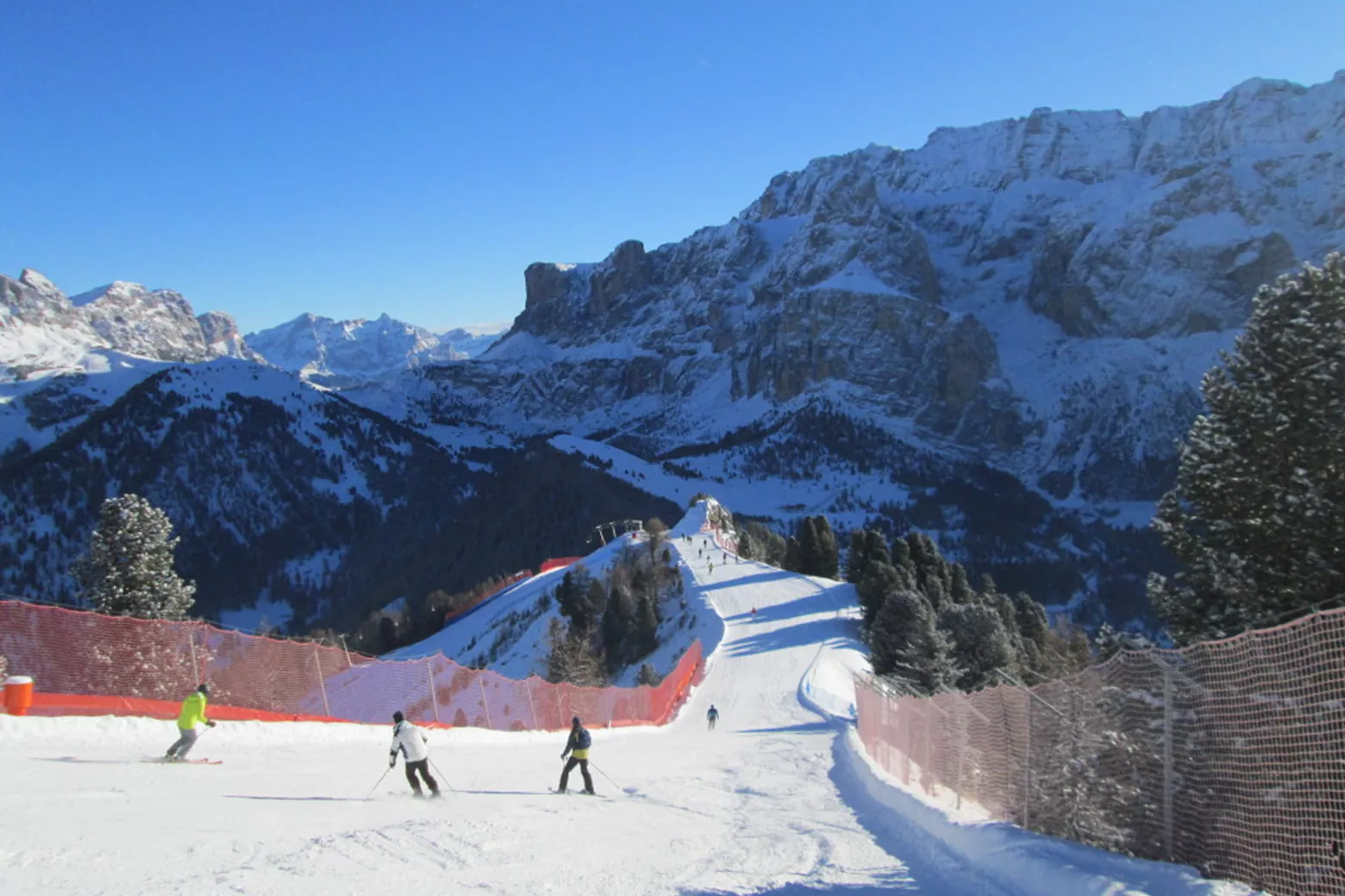 Jochgrimm in Italy - a group of people skiing down a snowy slope.