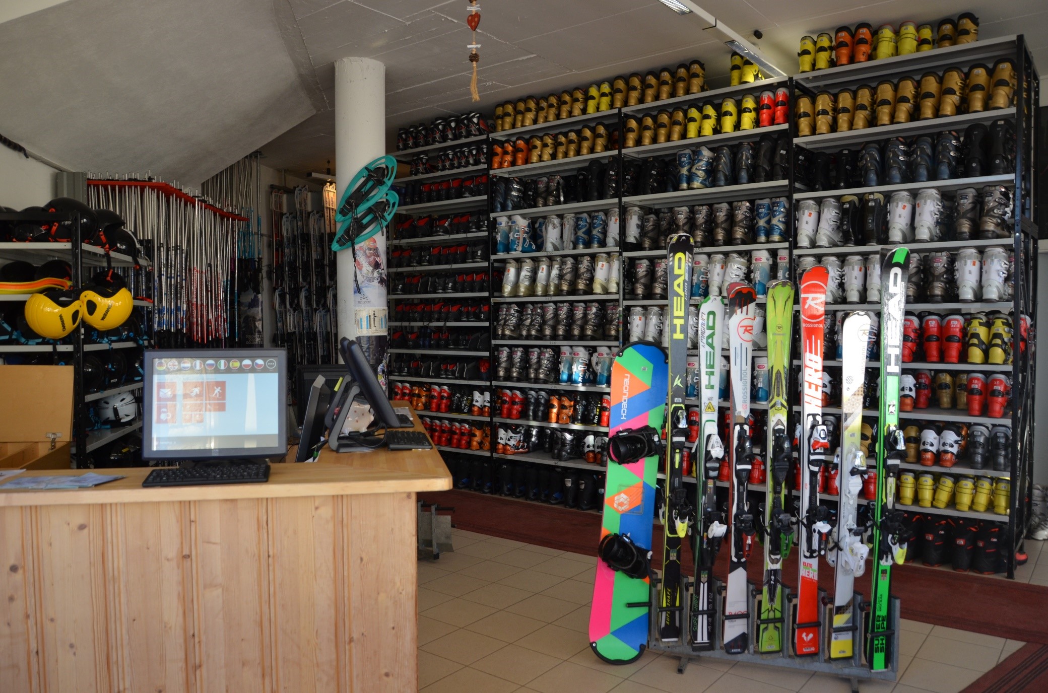 Image of Jochgrimm in Italy, featuring a bustling winter sports centre with a cozy chalet nearby. Skiers glide down the slopes of the ski resort, making for a vibrant winter sports scene.