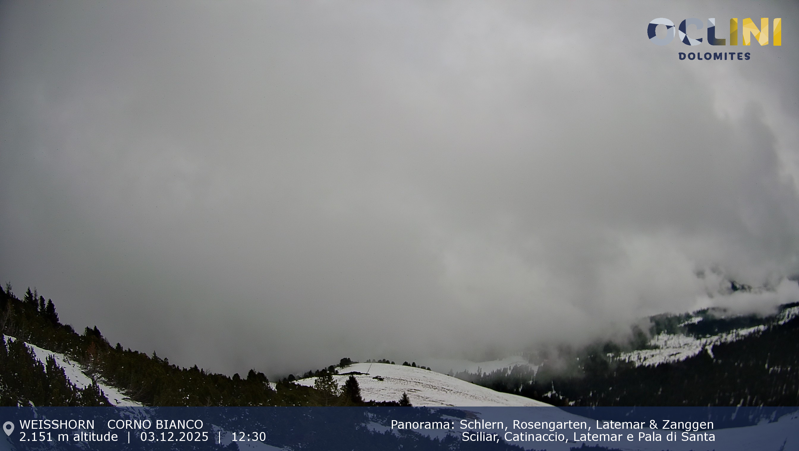 Winter sports enthusiasts engage in activities at Jochgrimm, South Tyrol, Italy. A charming chalet rests in the backdrop of a stunning winter scenery featuring a snowy mountain.
