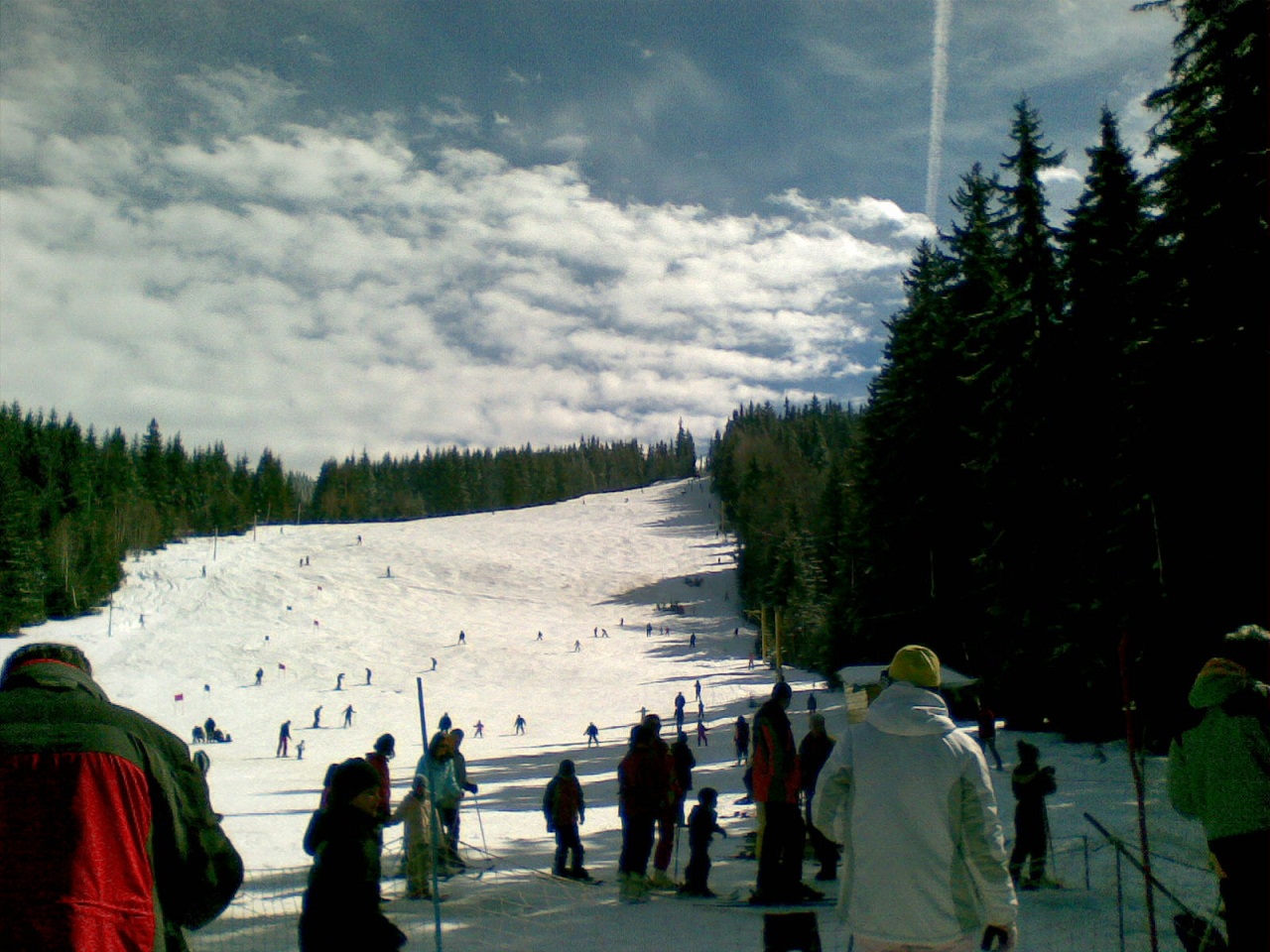 Vetrovala in Bulgaria - a group of people skiing down a snowy slope.