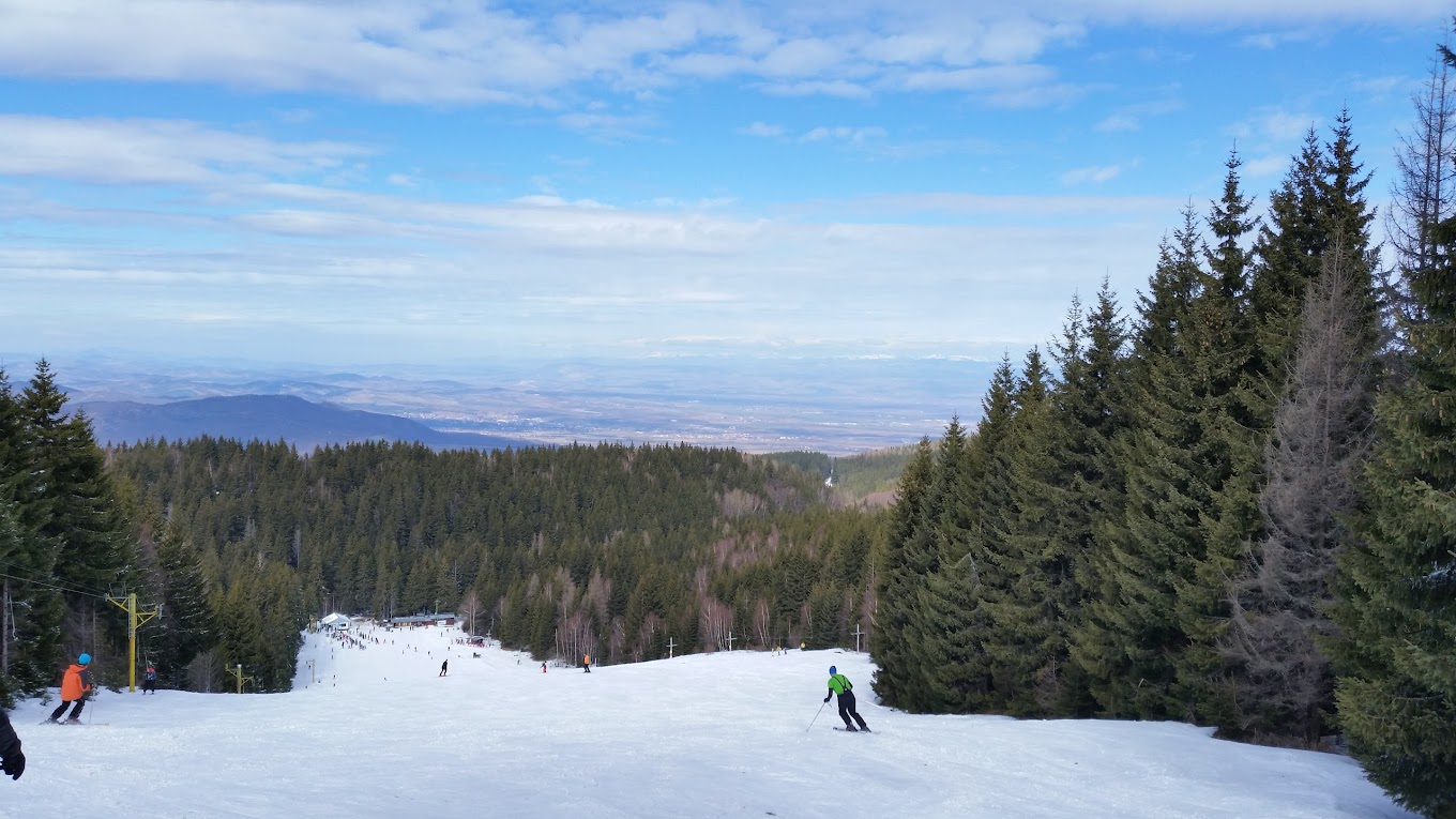 Vetrovala in Bulgaria - a group of people skiing down a snowy slope.