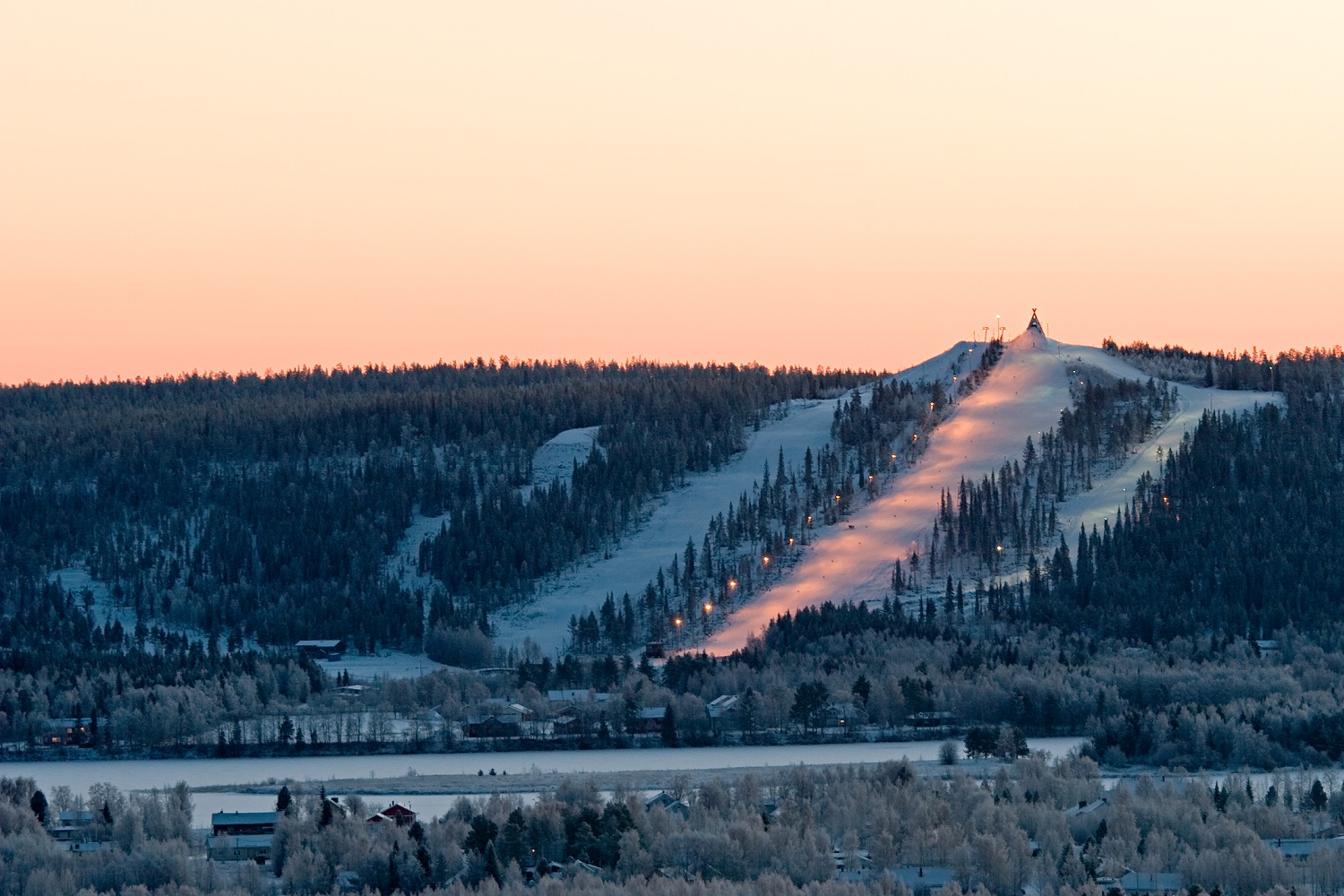 Ounasvaara – Rovaniemi in Finland - the sun is setting on the mountain.