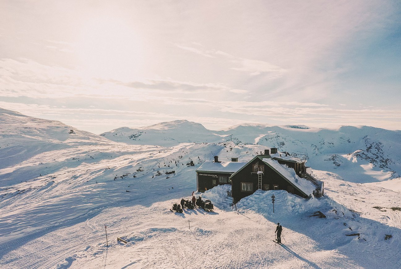 Fjällby – Björkliden in Sweden - a cabin in the middle of a snowy mountain.
