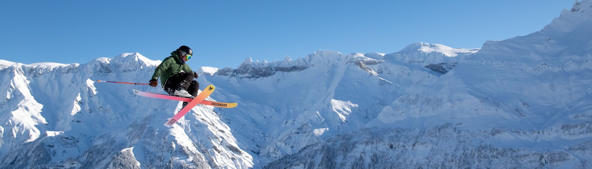 Elm in Switzerland - a group of people standing on top of a mountain.