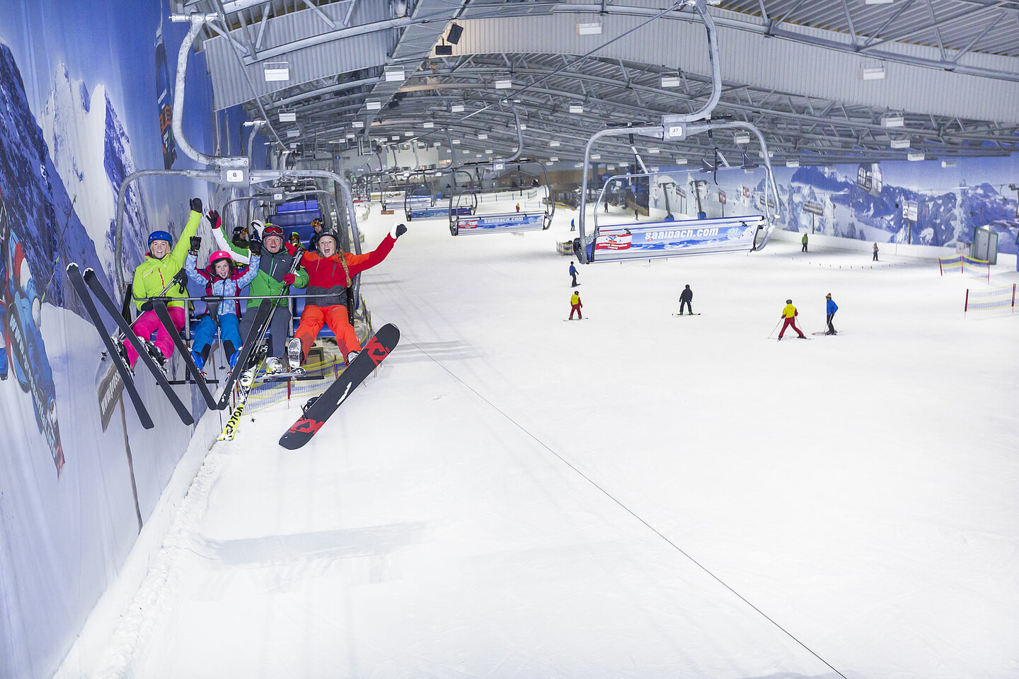 Alpenpark Neuss in Germany - a group of people riding ski boards down a slope.