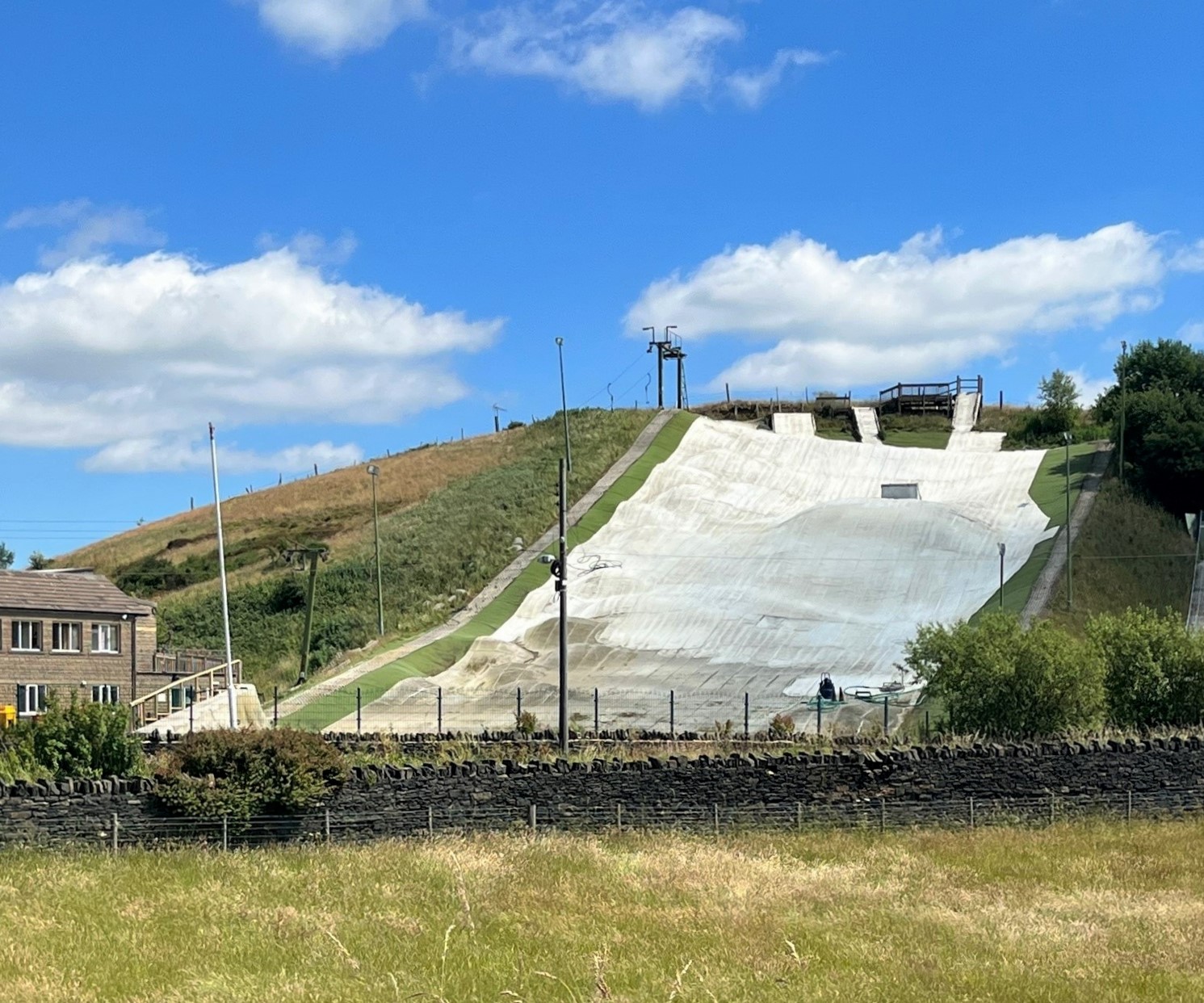 Halifax Ski Centre in United Kingdom - a skate park with a ramp on a hill.