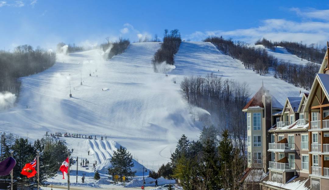 Gore Mountain in USA - a snow covered ski slope with a ski lift in the background.