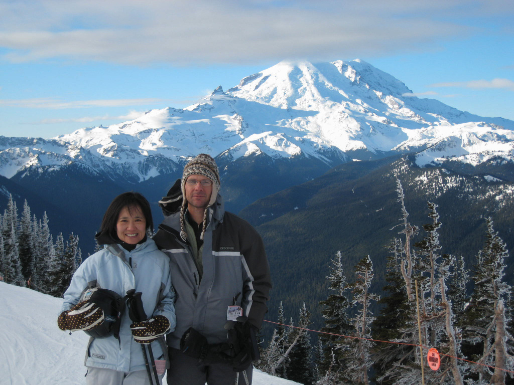 Crystal Mountain -WA in USA - two people standing on top of a snow covered mountain.