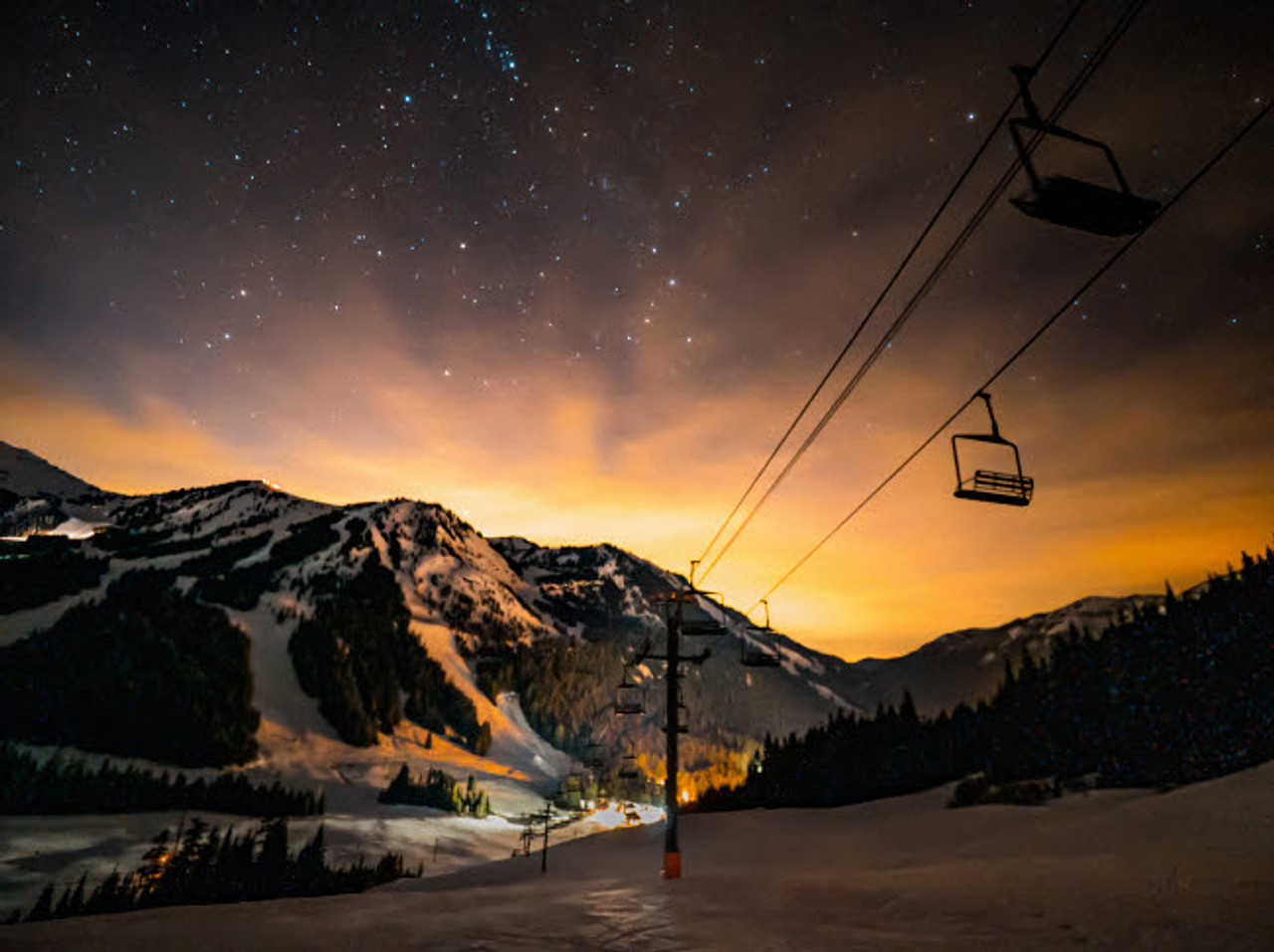 Crystal Mountain -WA in USA - a ski lift going up a snowy mountain.