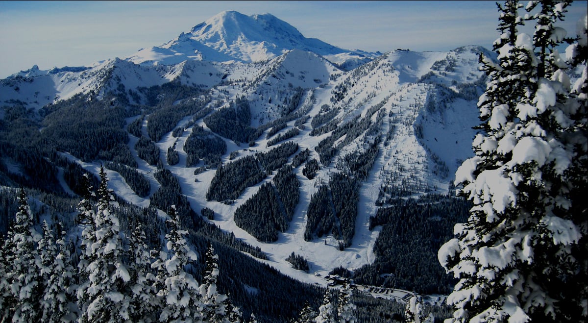 Crystal Mountain -WA in USA - snow covered trees and mountains in the distance.