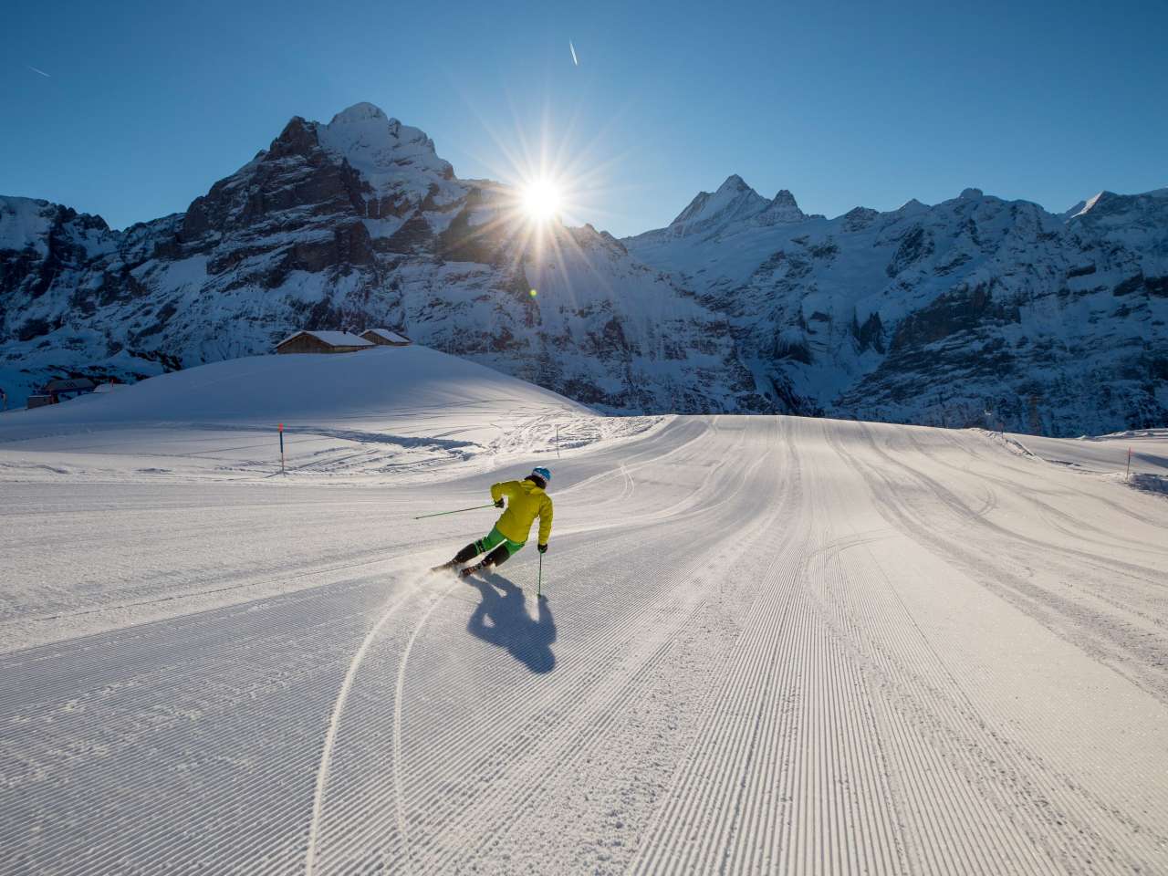 Grindelwald First in Switzerland - a person skiing down a snow covered mountain.
