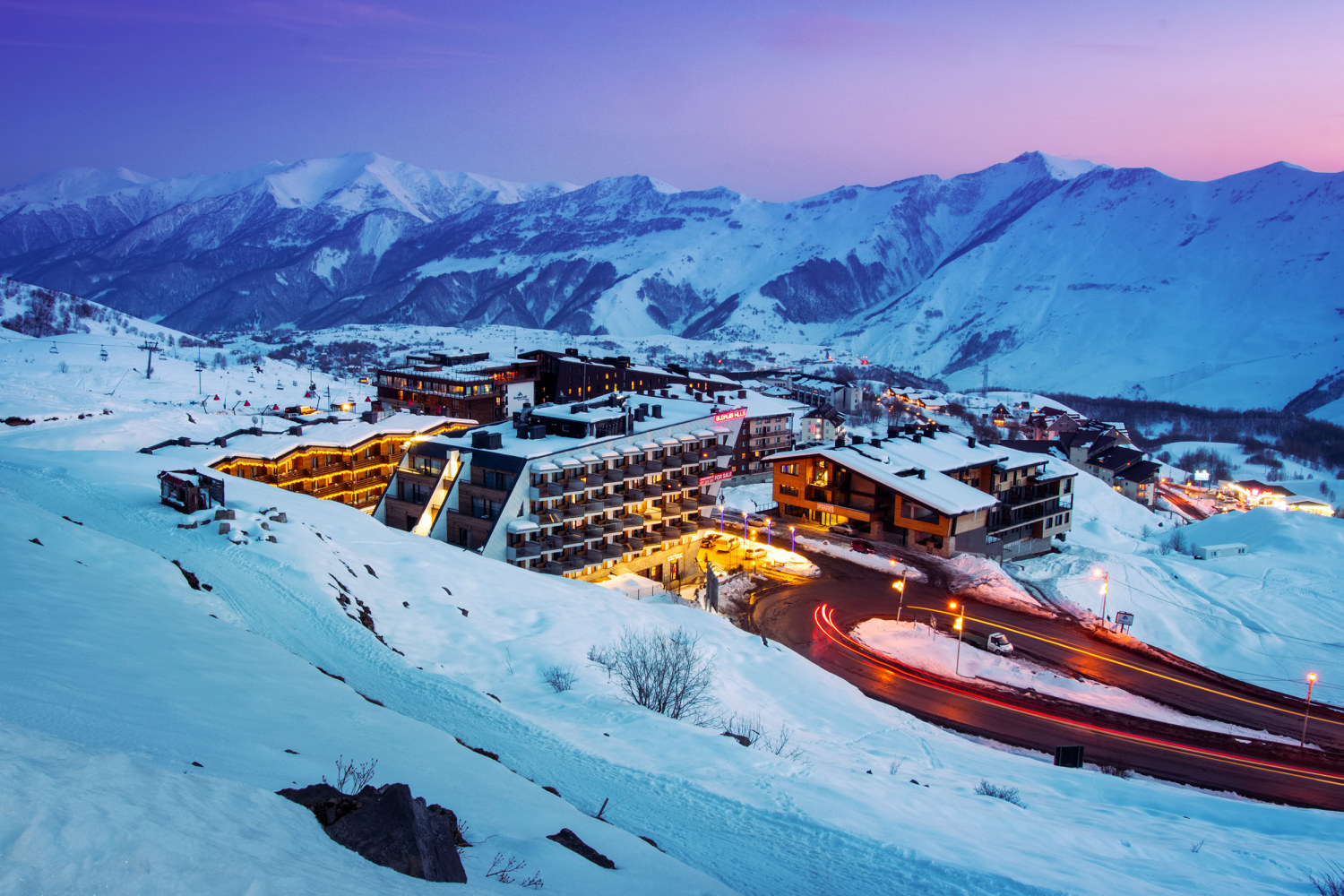 Gudauri in Georgia: a ski resort in the mountains at dusk.