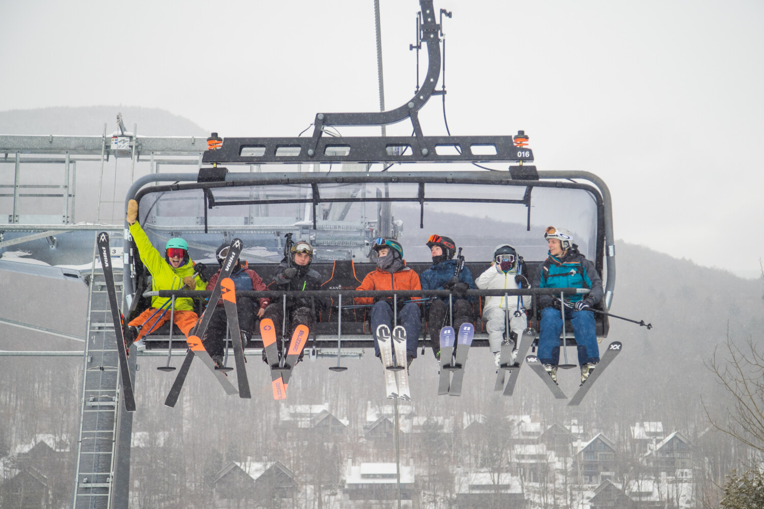 Loon Mountain Resort in USA - a group of people riding a ski lift.