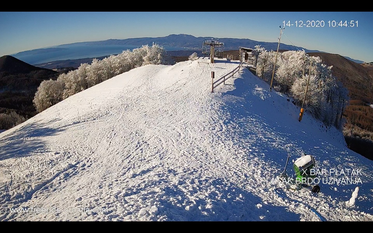 Vučići in Croatia - a snow covered hill with a ski lift in the background.
