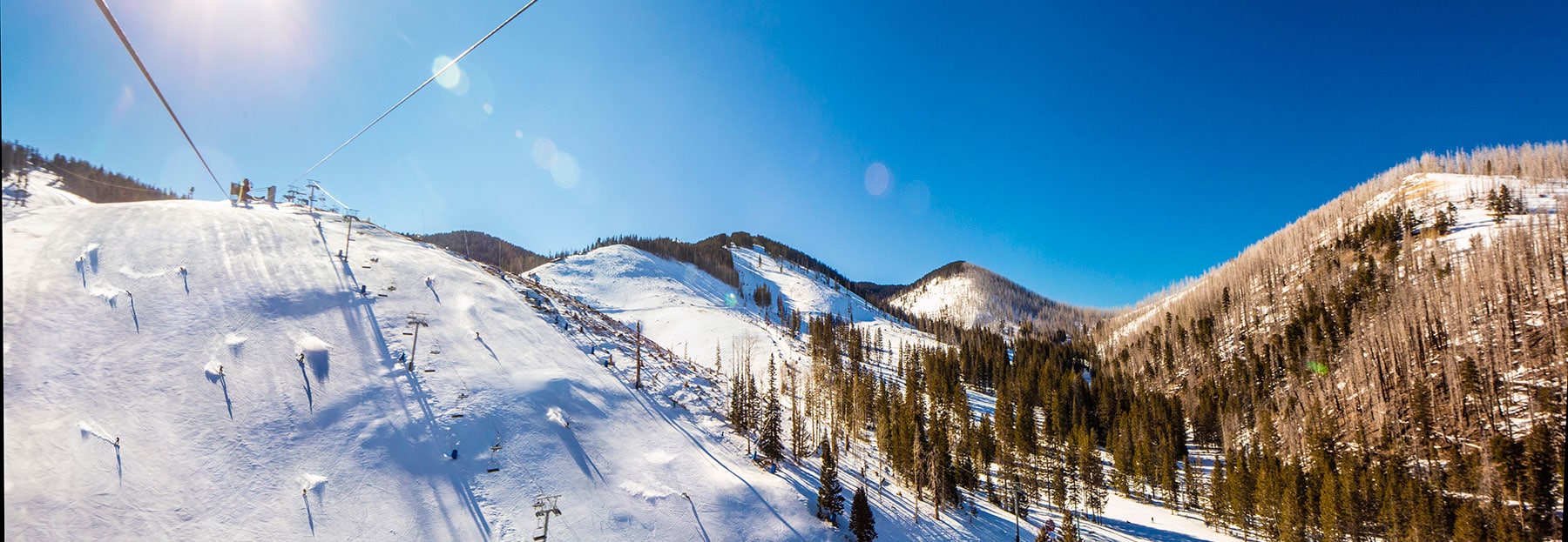 Ski Apache in USA - a person riding a ski board down a mountain.