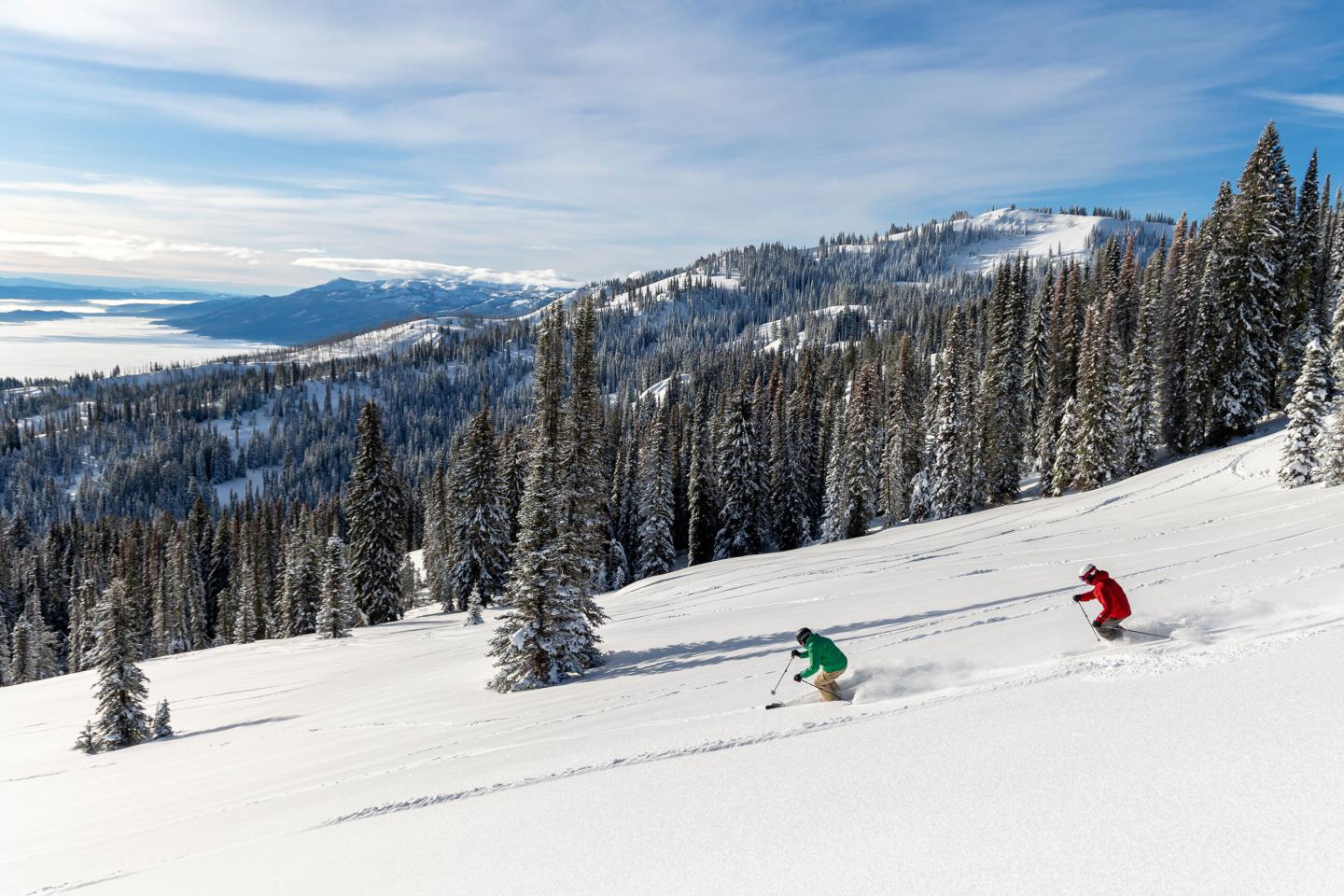 Tamarack Resort in USA - a person skiing down a snowy slope.