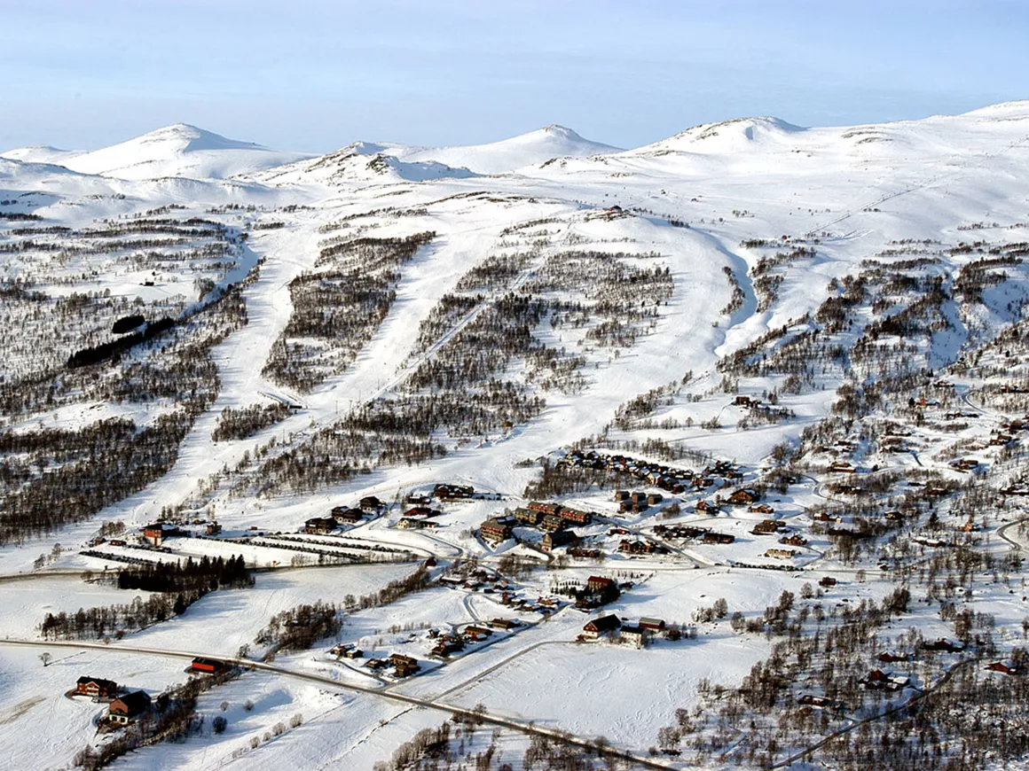 Oppdal in Norway: an aerial view of a ski resort in the mountains.