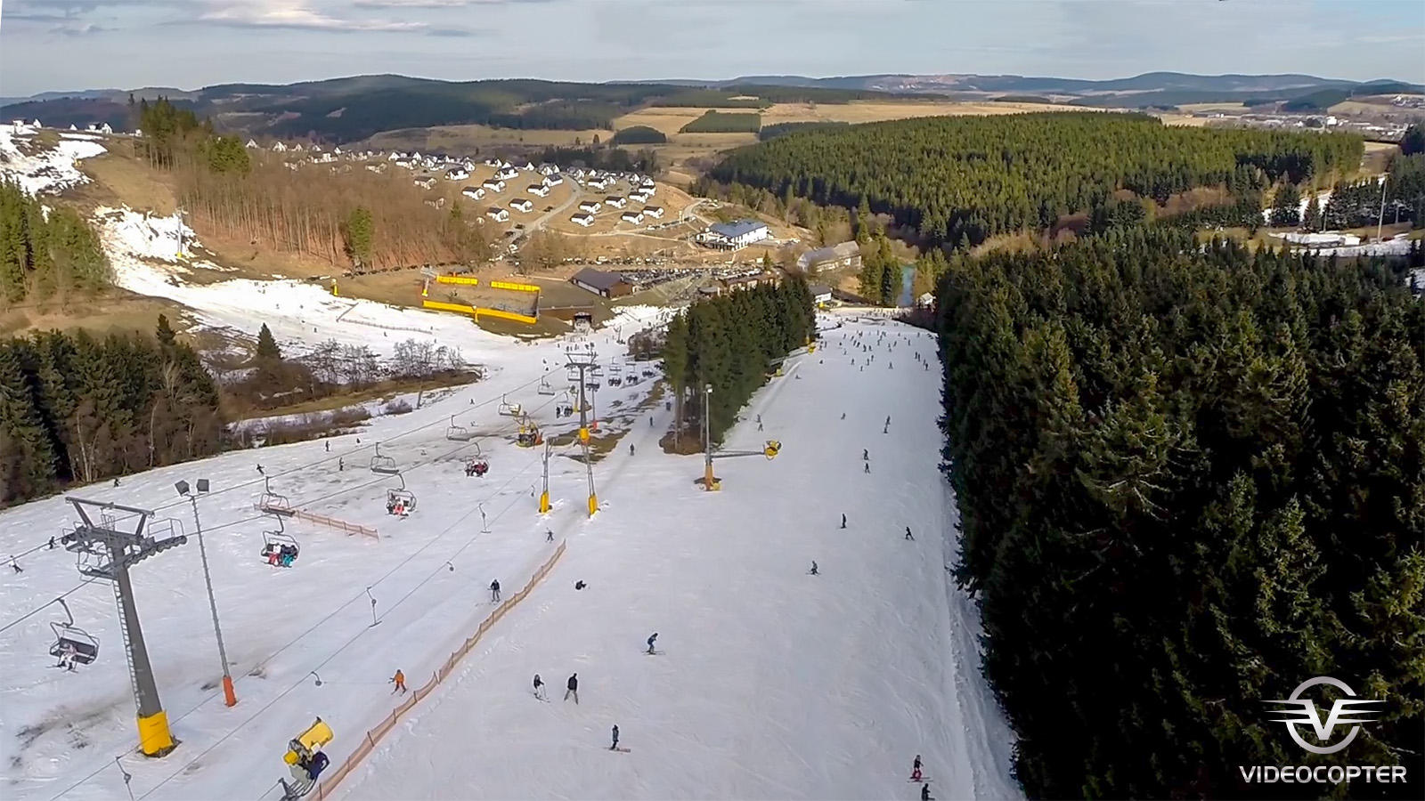 Winterberg in Germany - a ski slope with people skiing down it.