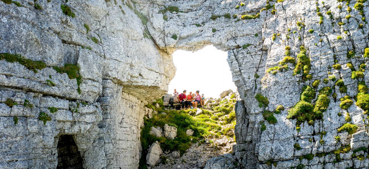 Loser Bergbahnen in Austria - a group of people standing on the edge of a cliff.