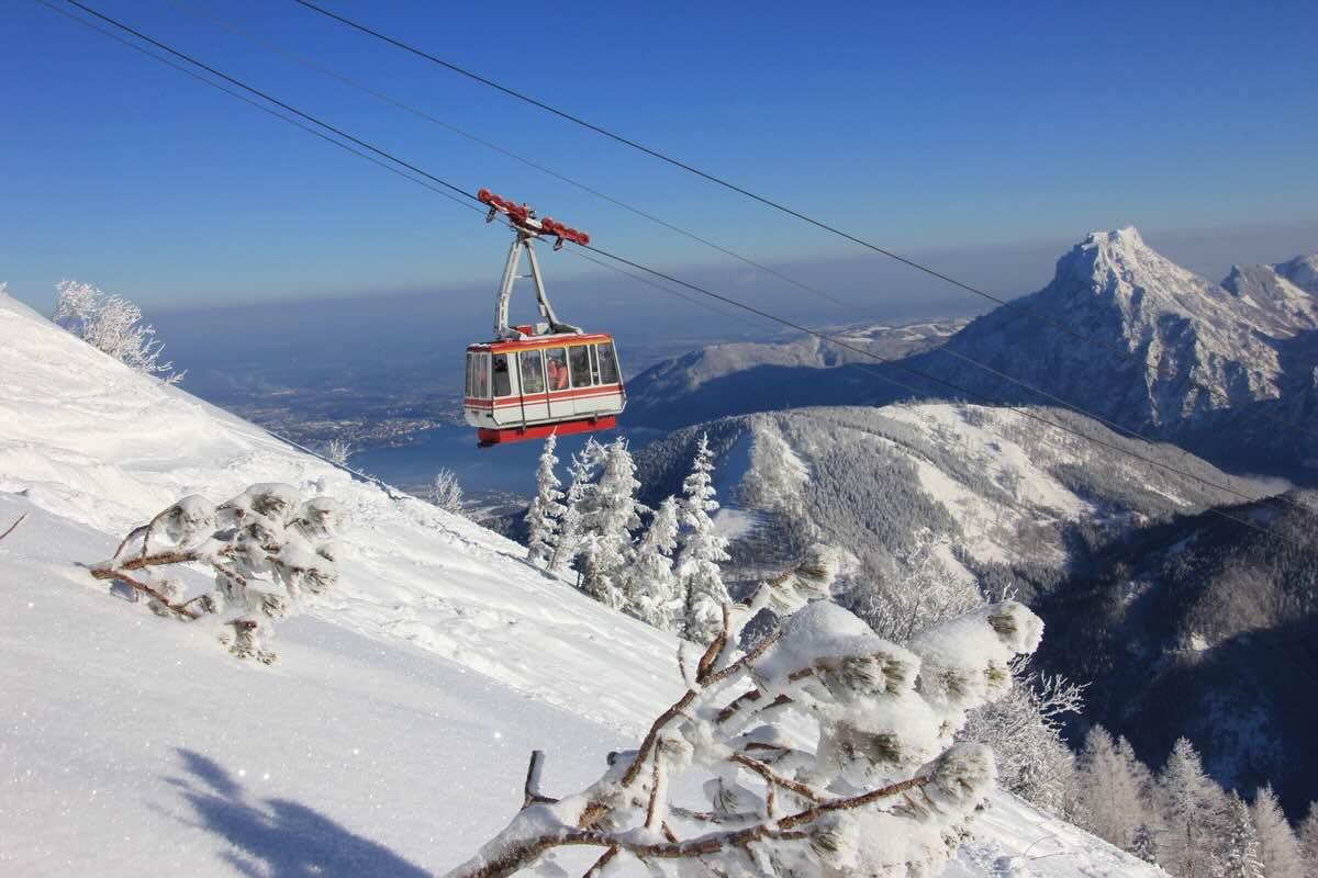 Feuerkogel – Ebensee in Austria - a ski lift going up a snowy mountain.