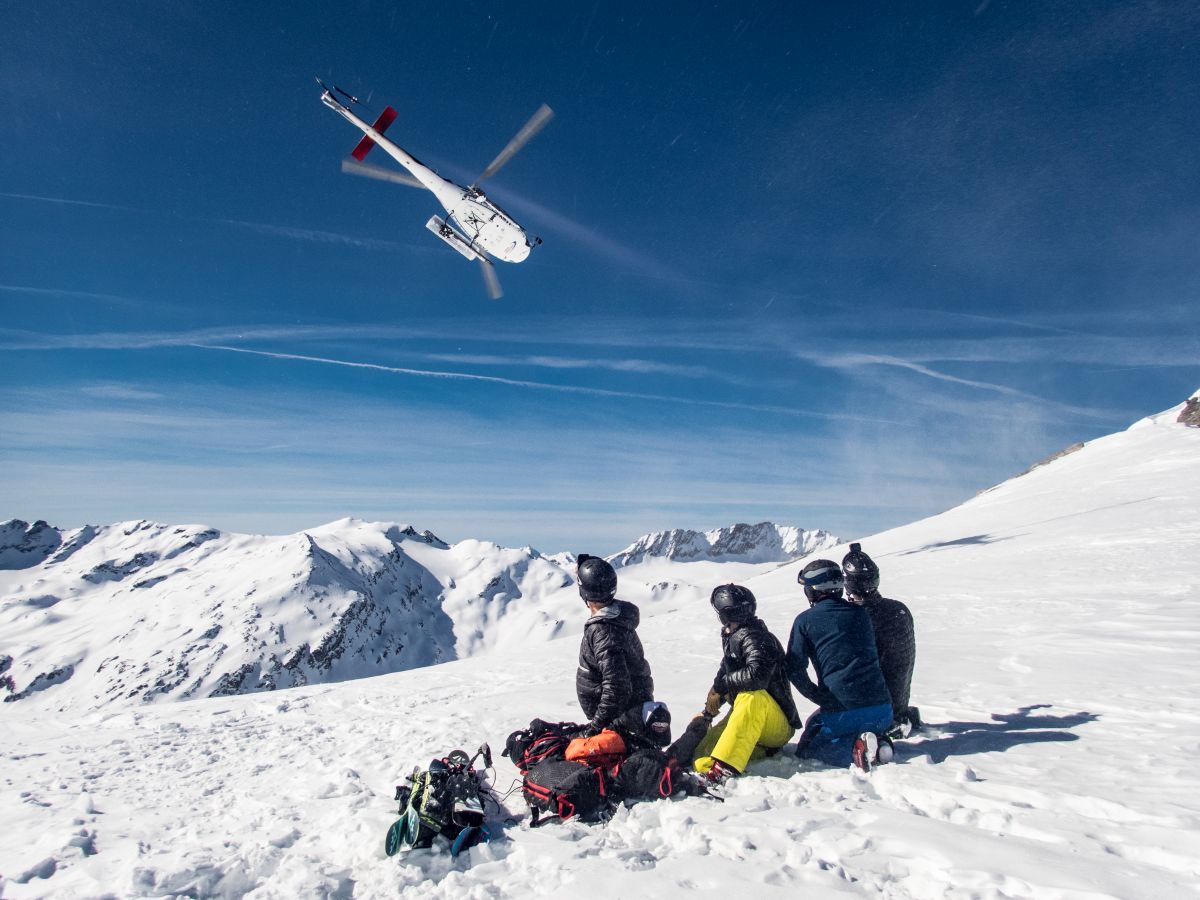 Sainte Foy in France - a group of people sitting in the snow.