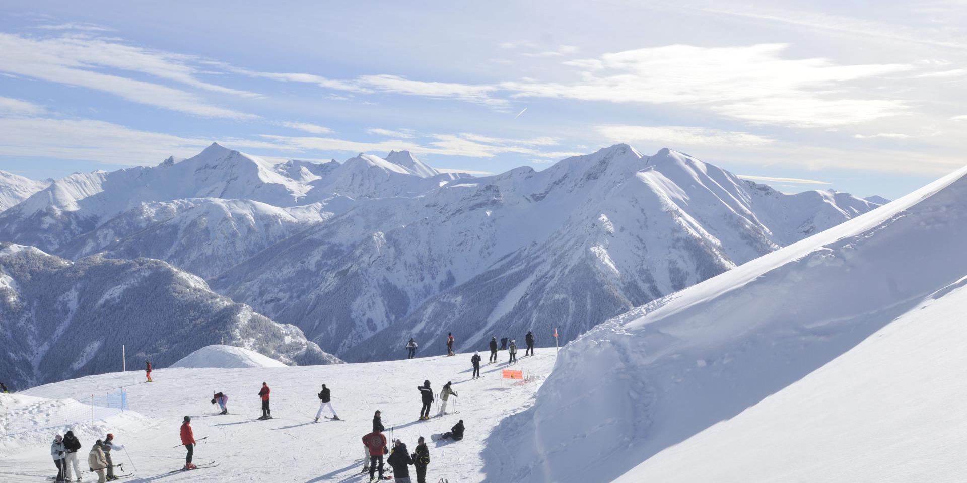 Super Sauze in France - a group of people skiing down a snowy mountain.