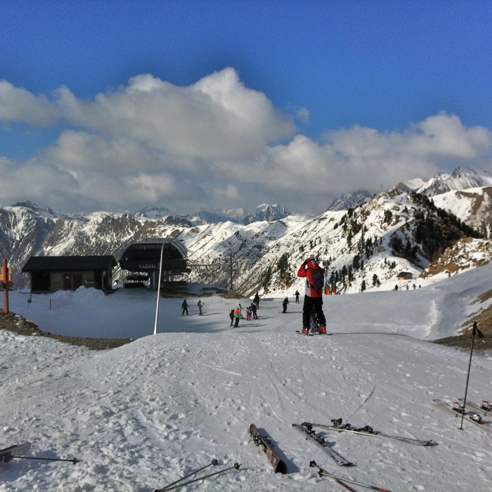Super Sauze in France - a group of people skiing down a snow covered mountain.