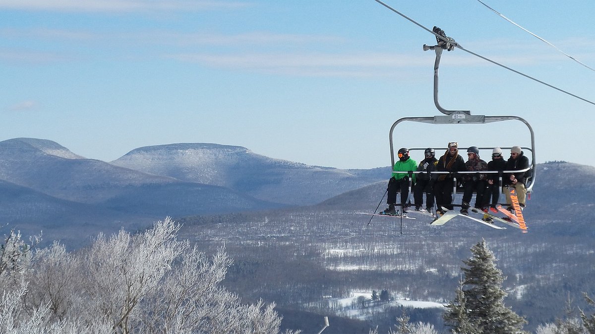 Hunter Mountain in USA - a group of people riding a ski lift.