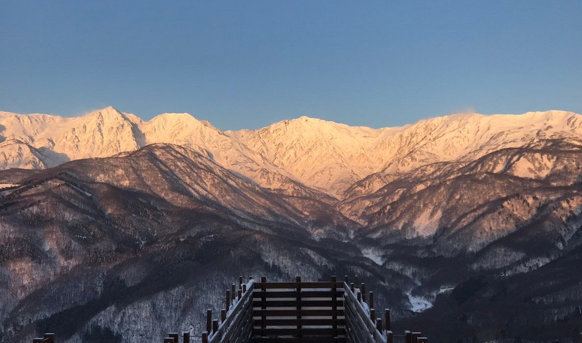 Hakuba Iwatake Mountain Resort in Japan - a view of the mountains from the top of a mountain.