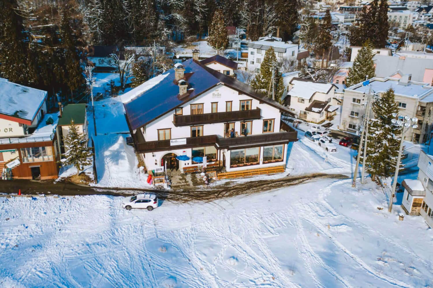Hakuba Happo-One Snow Resort in Japan - an aerial view of a small town in the mountains.
