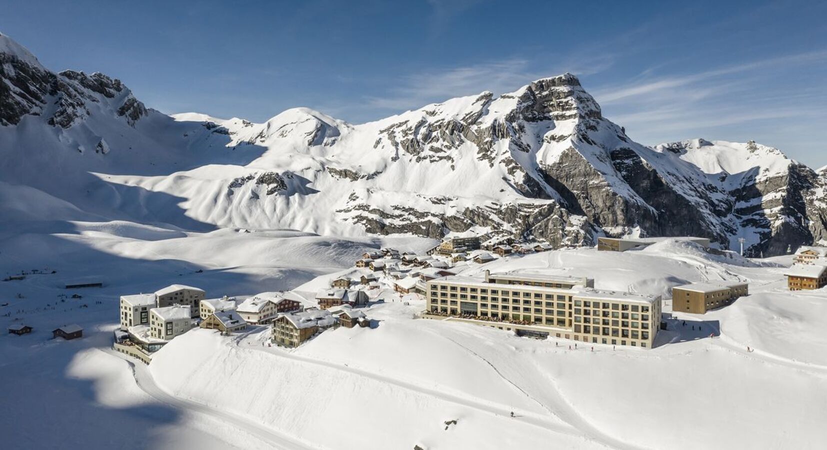 Melchsee-Frutt in Switzerland: the hotel is surrounded by snow covered mountains.