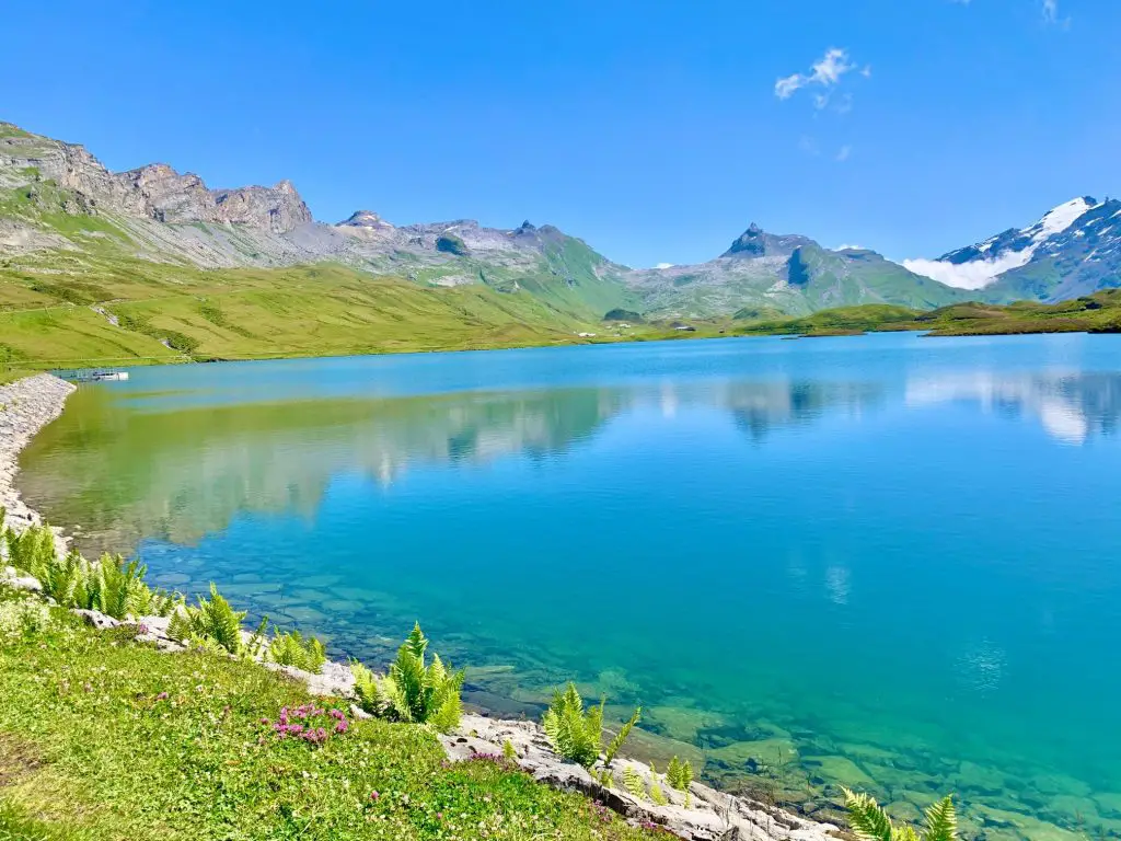 Melchsee-Frutt in Switzerland - a lake surrounded by mountains in the swiss alps.