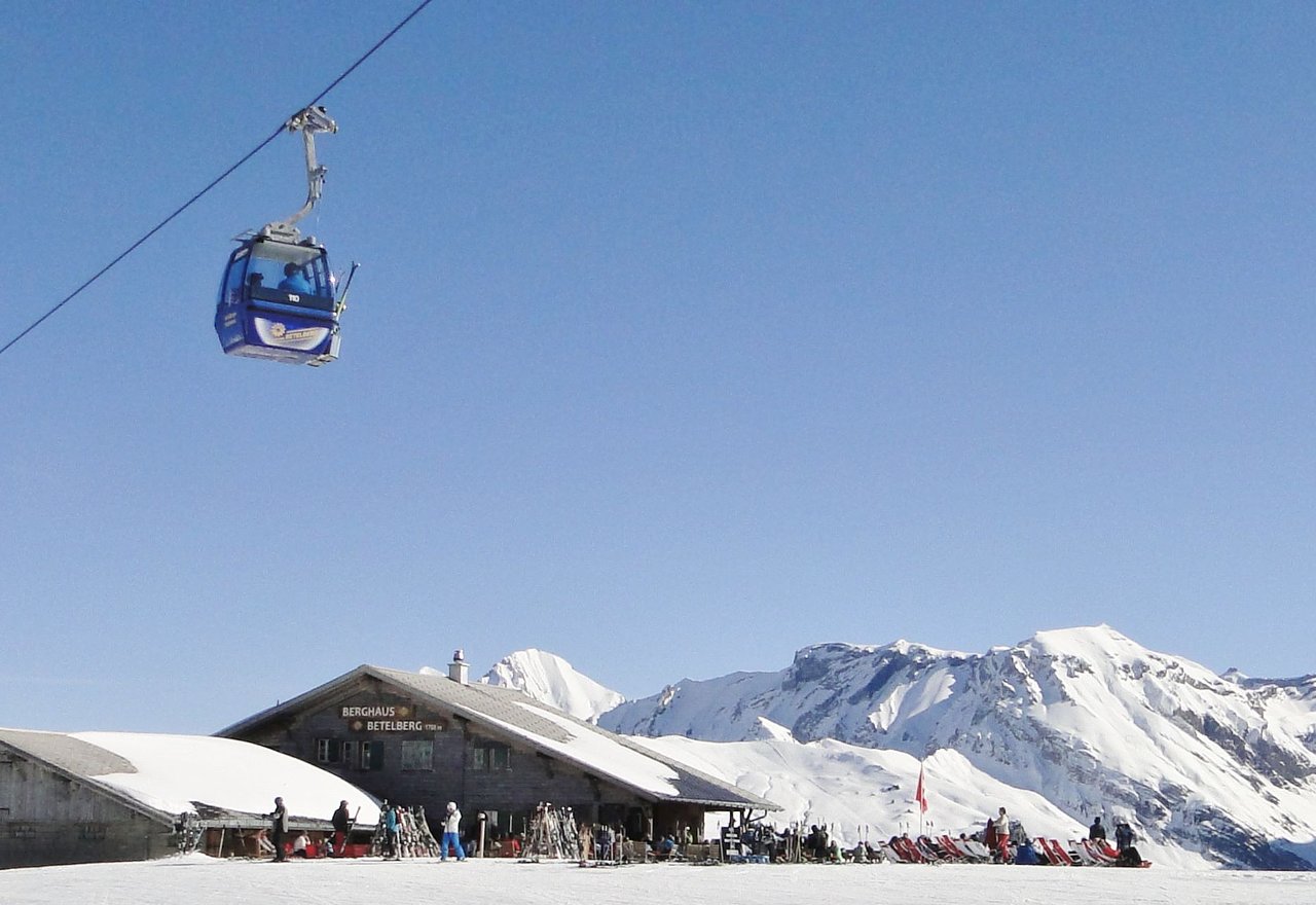 Betelberg in Switzerland - a person riding a ski lift in the air.