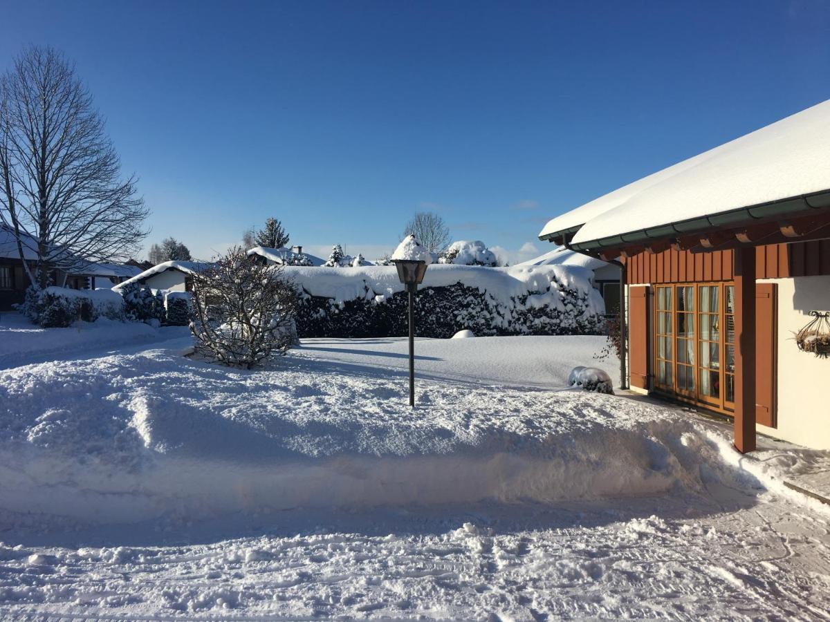 Lechbruck am See in Germany - a snow covered yard in front of a house.