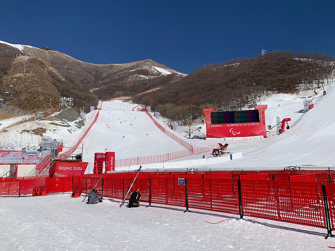 Yanqing National Alpine Ski Centre in China - a red fence in the snow.