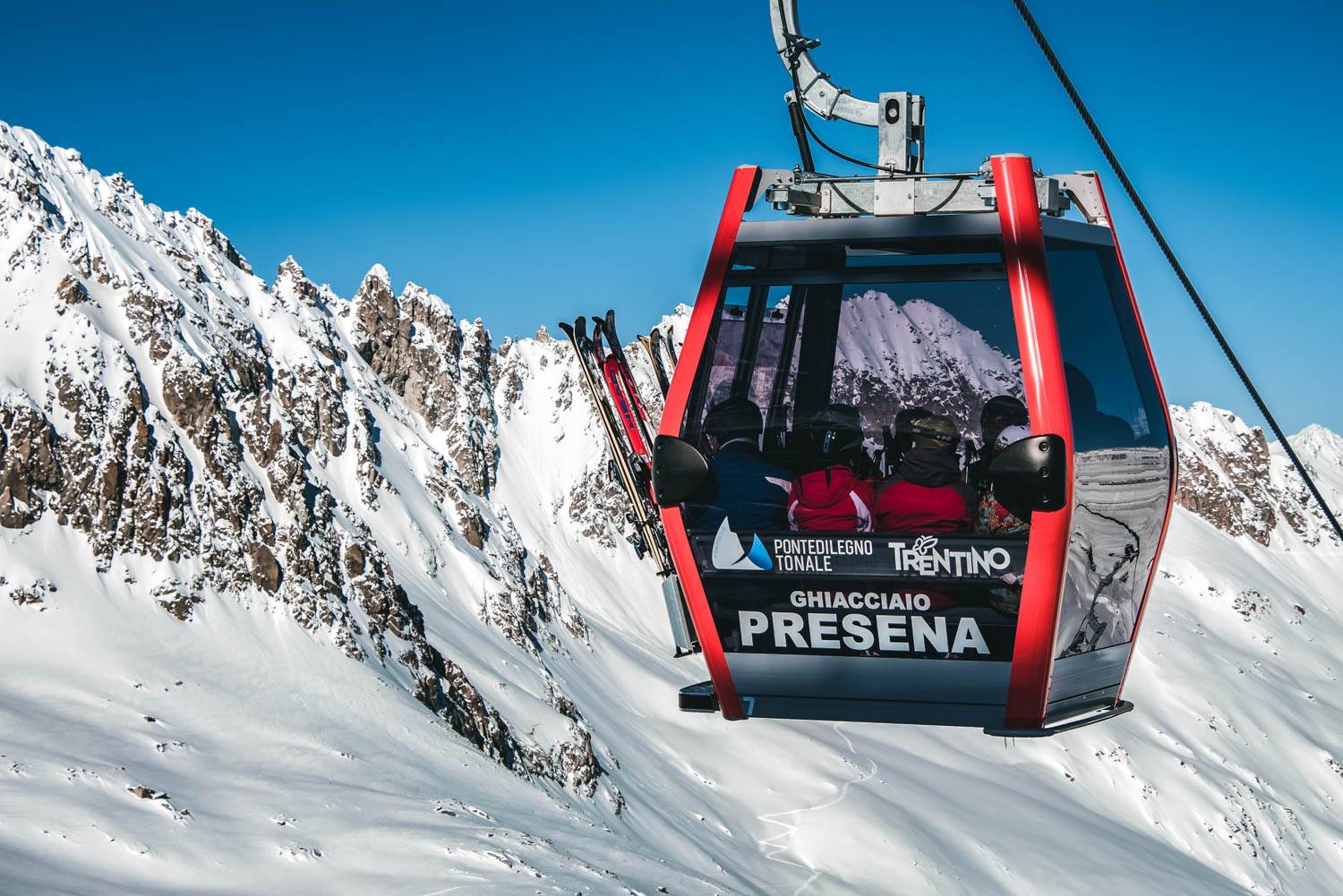 Consorzio Pontedilegno-Tonale (Ponte di Legno | ​Tonale | ​Presena Glacier Temù) in Italy - a ski lift going up a mountain.