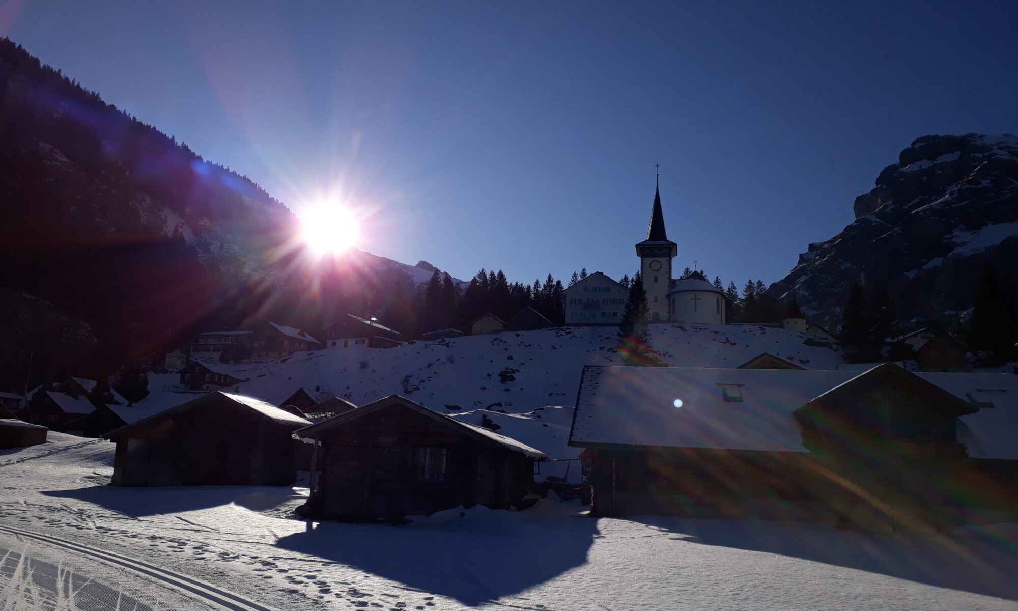 Urnerboden in Switzerland - the sun is shining in the sky.