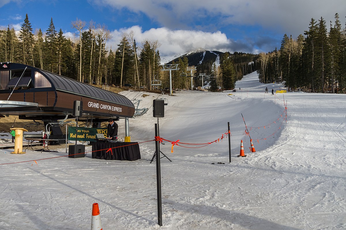 Arizona Snowbowl in USA - a ski slope with a ski lift in the background.