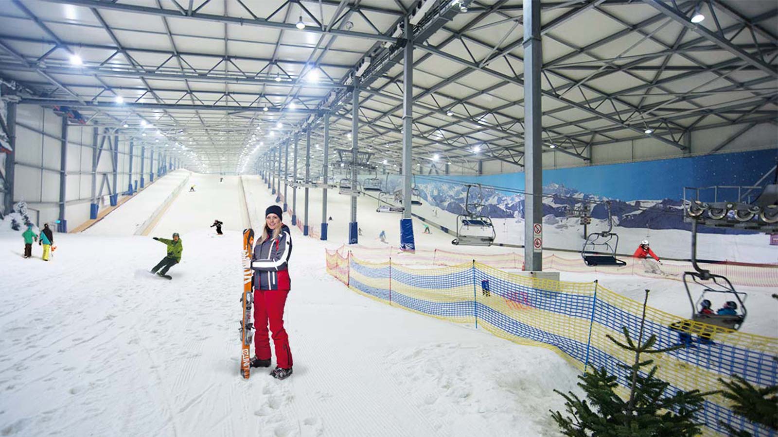 Snow Dome Bispingen in Germany - a group of people riding ski boards down a slope.