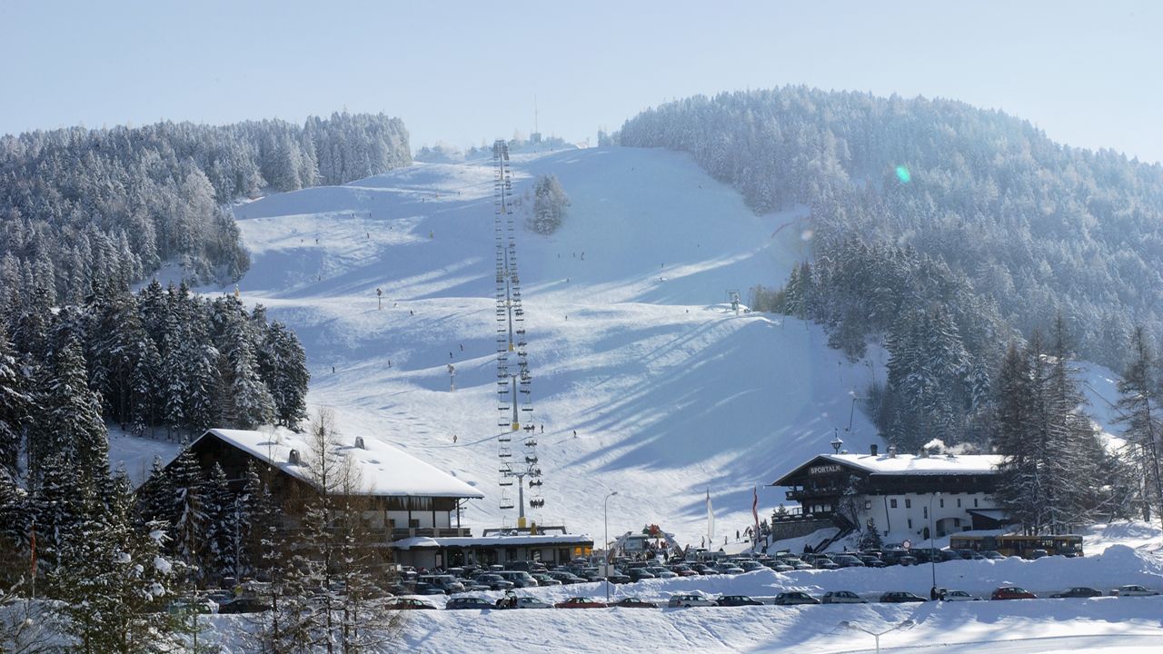 Gschwandtkopf – Seefeld in Austria - a snow covered mountain with a ski lift in the background.
