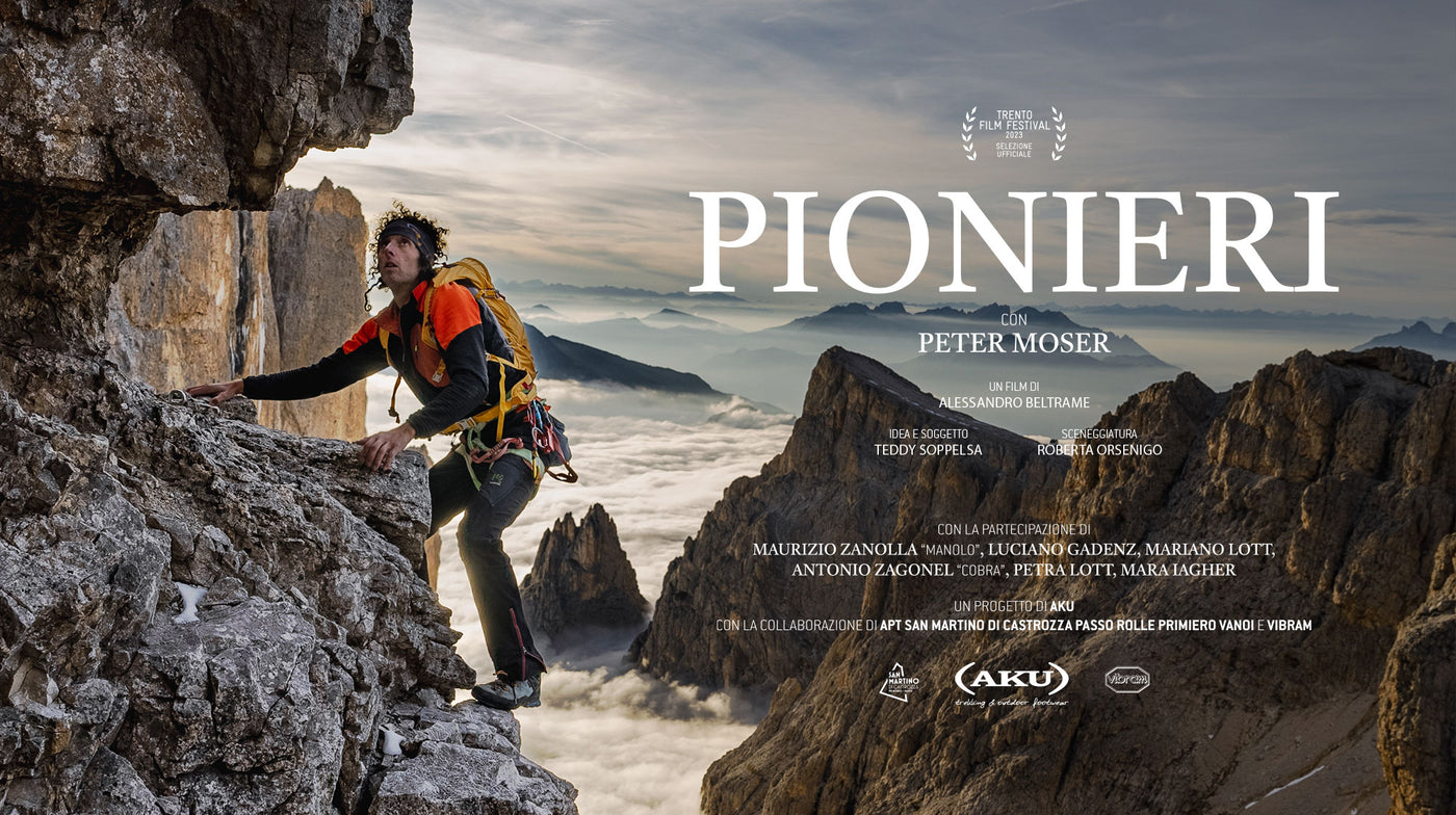 San Martino di Castrozza | Passo Rolle in Italy - a man climbing on top of a mountain.