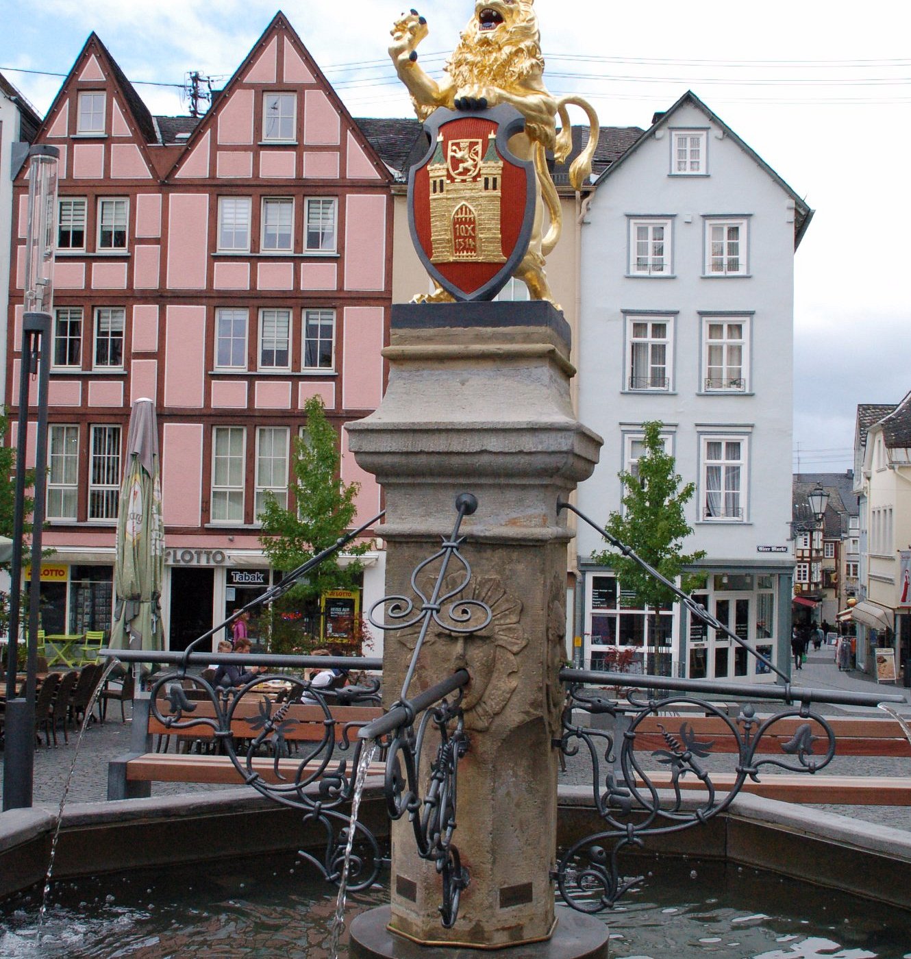 Hachenburg in Germany - a fountain with a statue on top of it.