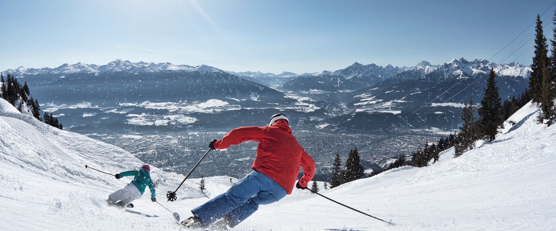 Nordkette – Innsbruck in Austria - a person skiing down a snowy slope in the mountains.