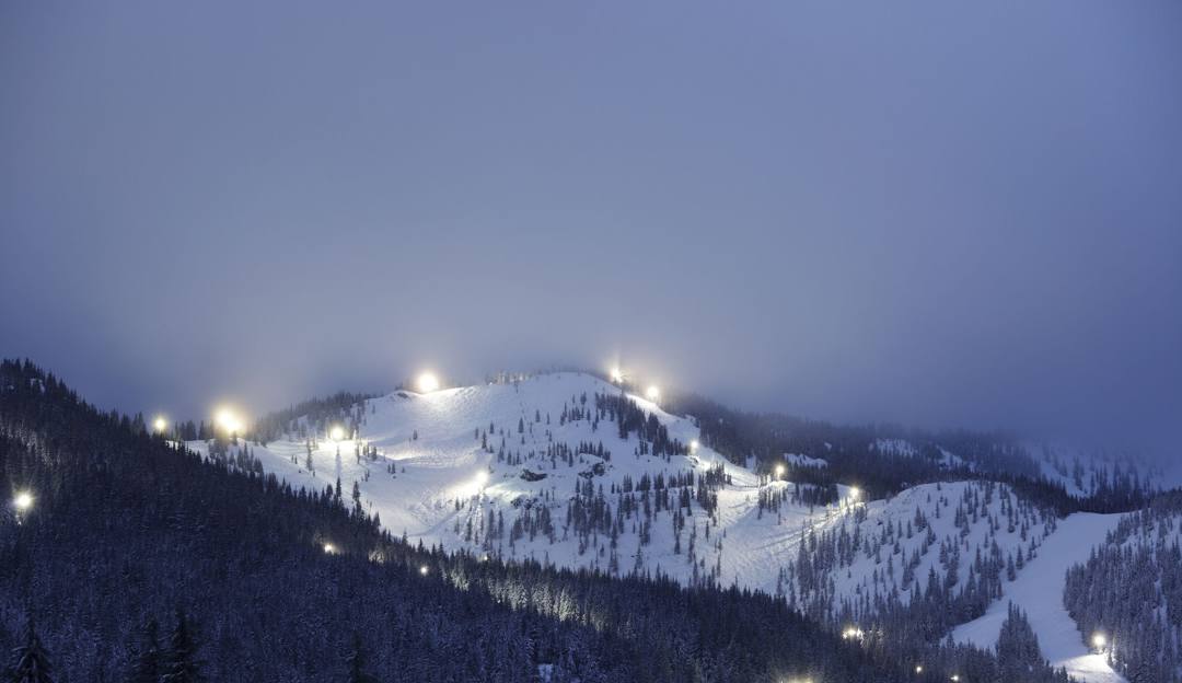 Mt Hood Skibowl in USA - a ski slope covered in snow at night.