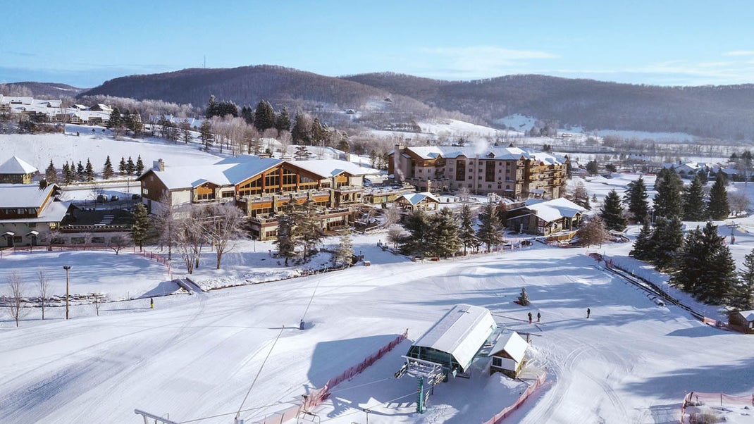 Holiday Valley Resort in USA: a ski resort surrounded by trees and snow.